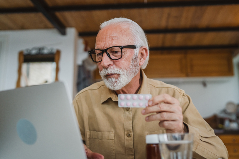 senior man shopping for supplements online