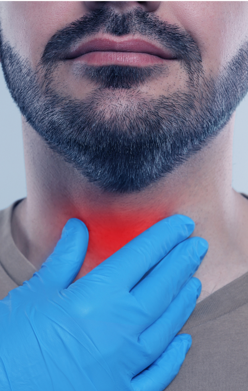 gloved hand on man's throat to feel thyroid